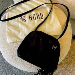 Hobo crossbody bag lightly used with original protective storage bag.